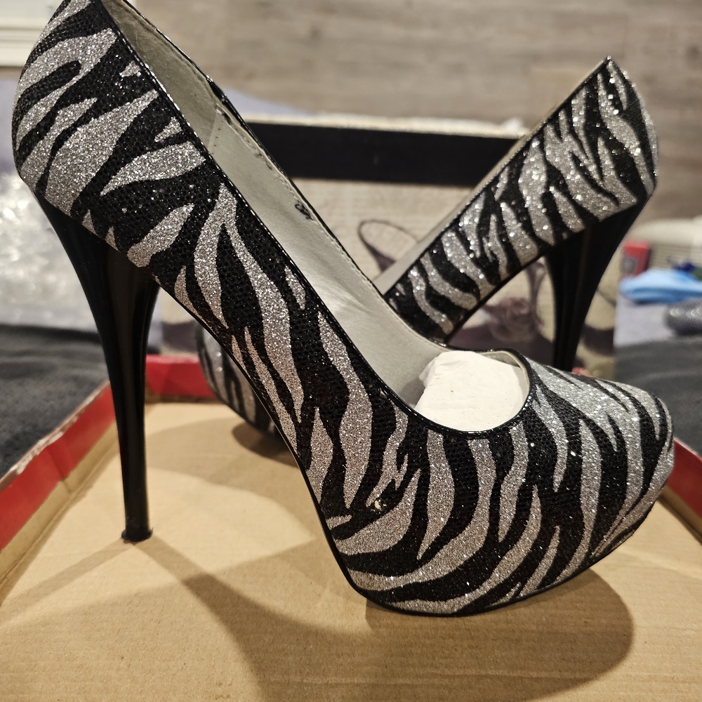 Silver and black pumps